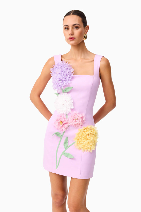 Brunette model wearing Buttercup Embroidered Party Mini Dress Purple close up shot 