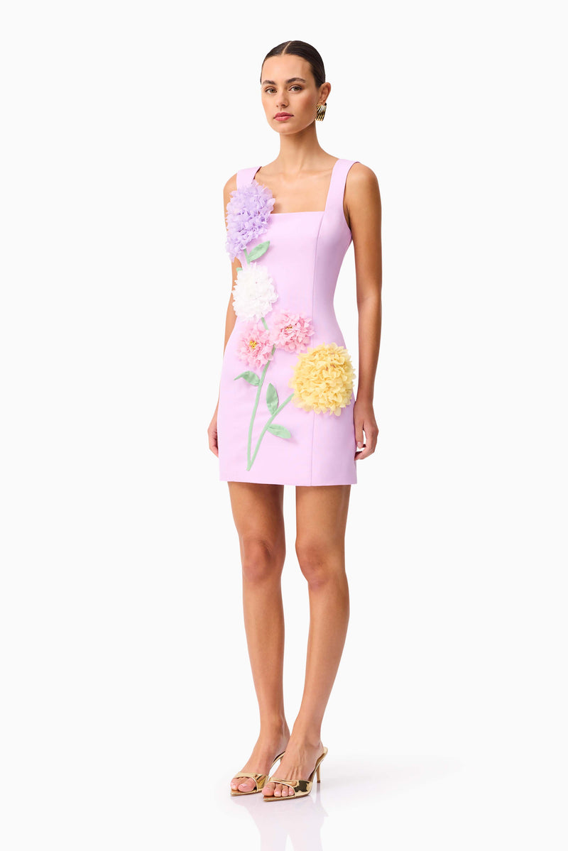 Brunette model wearing Buttercup Embroidered Party Mini Dress Purple side shot 