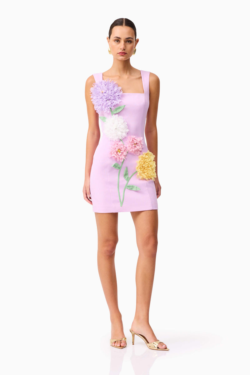 Brunette model wearing Buttercup Embroidered Party Mini Dress Purple posed shot 