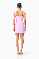 Brunette model wearing Buttercup Embroidered Party Mini Dress Purple back shot 