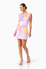 Brunette model wearing Buttercup Embroidered Party Mini Dress Purple posed looking away shot 