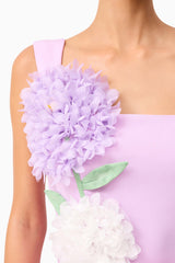 Brunette model wearing Buttercup Embroidered Party Mini Dress Purple detail shot 