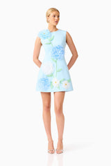 Blonde model wearing the Buttercup Embroidered Mini Dress in Blue posed shot