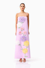 Brunette model wearing Buttercup Embroidered Maxi Dress in Purple front shot