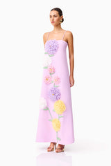 Brunette model wearing Buttercup Embroidered Maxi Dress in Purple side shot