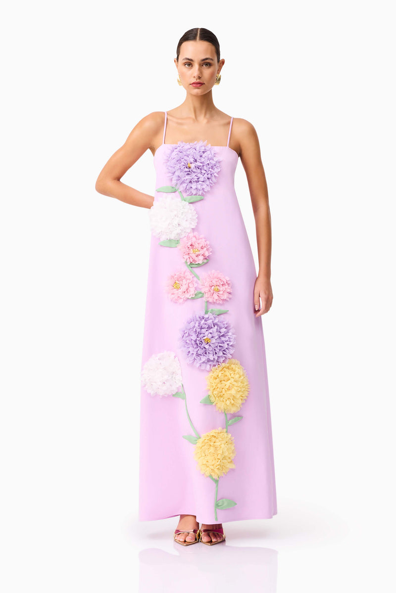 Brunette model wearing Buttercup Embroidered Maxi Dress in Purple posed hand on hip shot