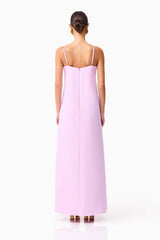 Brunette model wearing Buttercup Embroidered Maxi Dress in Purple back shot