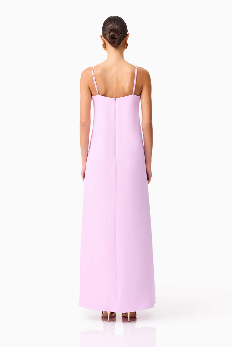 Brunette model wearing Buttercup Embroidered Maxi Dress in Purple back shot