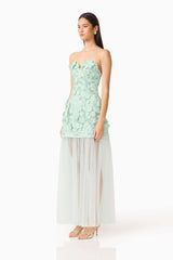 Brunette model wearing the Roseate Floral Maxi Dress in Mint Green side shot 