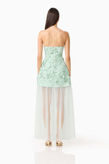 Brunette model wearing the Roseate Floral Maxi Dress in Mint Green back shot 