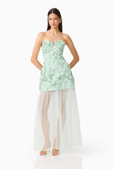 Brunette model wearing the Roseate Floral Maxi Dress in Mint Green posed shot 