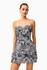 Brunette model wearing Roseate Floral Mini Dress in Black close up shot