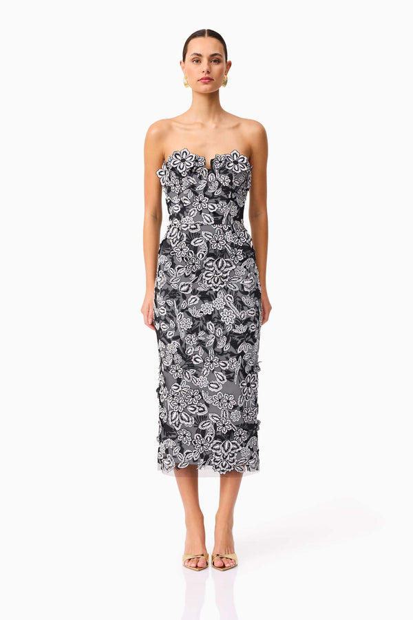 Brunette model wearing Roseate Strapless Midi Dress in Black front shot