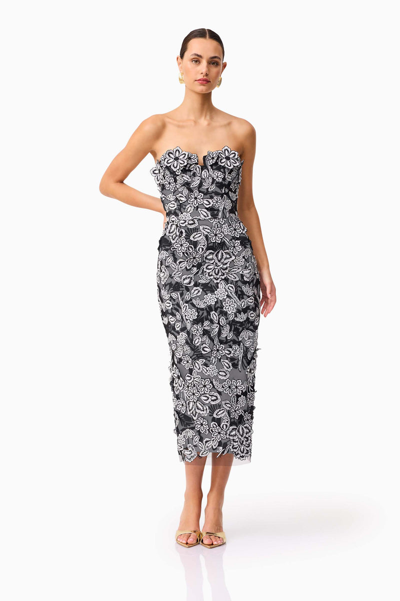 Brunette model wearing Roseate Strapless Midi Dress in Black posed shot