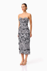 Brunette model wearing Roseate Strapless Midi Dress in Black side shot