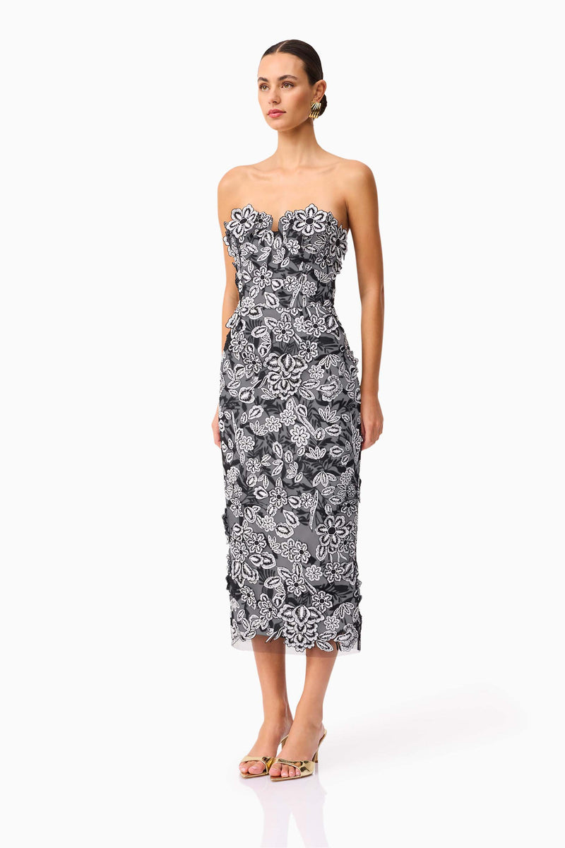 Brunette model wearing Roseate Strapless Midi Dress in Black side shot
