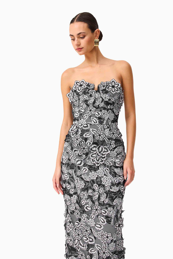 Brunette model wearing Roseate Strapless Midi Dress in Black posed shot