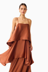 Brunette model wearing the Tilly Tiered Maxi Dress in Brown close up shot