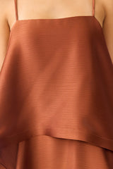 Brunette model wearing the Tilly Tiered Maxi Dress in Brown detail shot