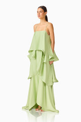 Brunette model wearing the Tilly Tiered Maxi Dress in Sage Green side shot