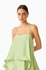 Brunette model wearing the Tilly Tiered Maxi Dress in Sage Green close up shot