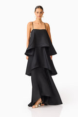 Brunette model wearing Tilly Tiered Maxi Dress in Black posed front shot