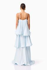 Brunette model wearing Tilly Tiered Maxi Dress in Blue back shot