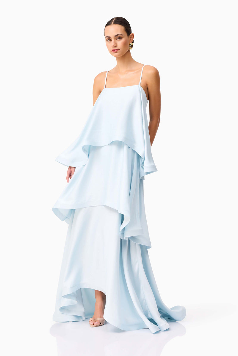 Brunette model wearing Tilly Tiered Maxi Dress in Blue side looking forward shot