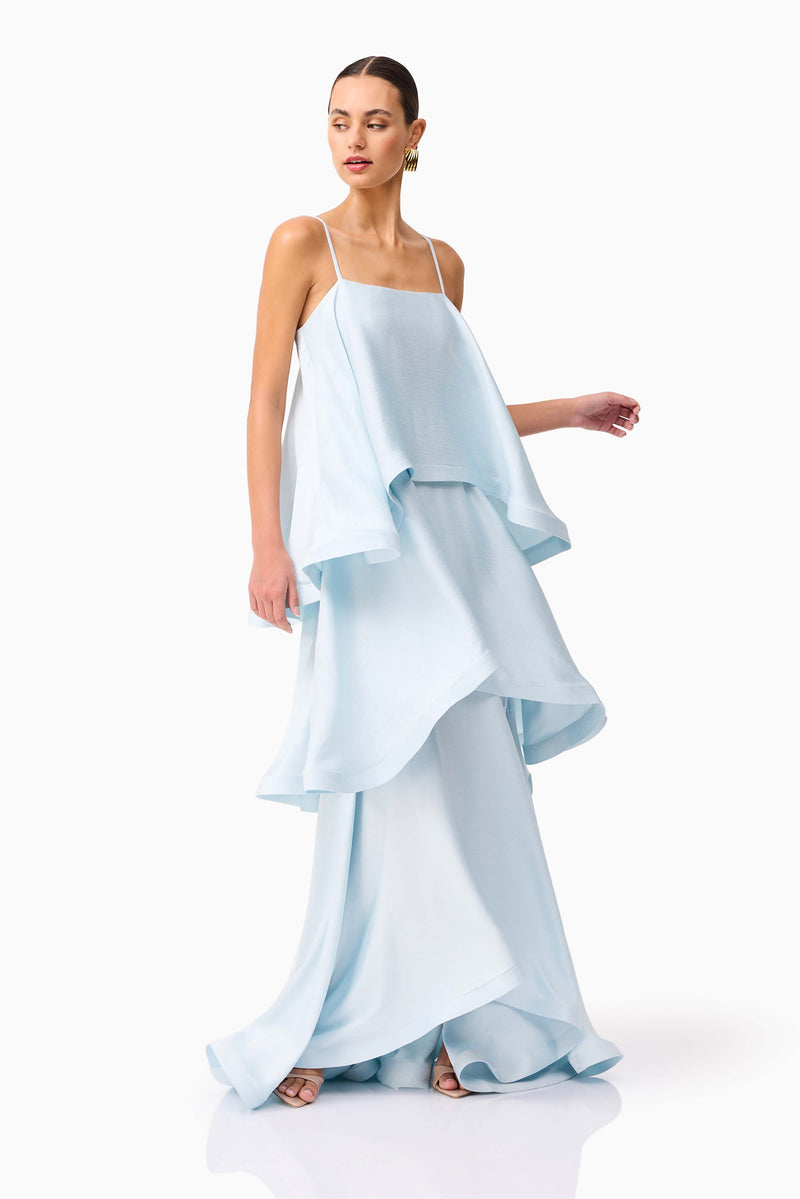 Brunette model wearing Tilly Tiered Maxi Dress in Blue looking away shot