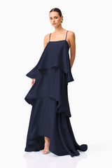 Tilly Tiered Maxi Dress in Navy with a tiered relaxed silhouette & square neckline posed leaning shot