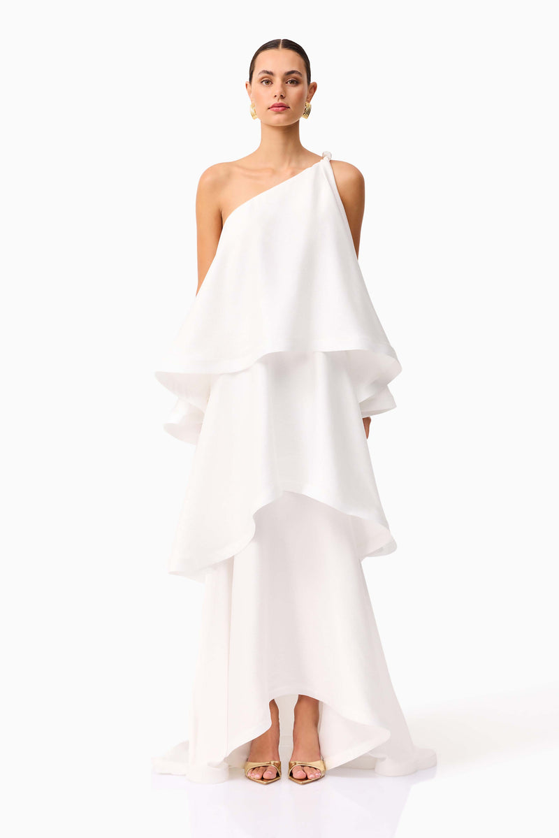 Brunette model wearing Tilly One Shoulder Maxi Dress in White front shot