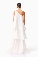 Brunette model wearing Tilly One Shoulder Maxi Dress in White back shot
