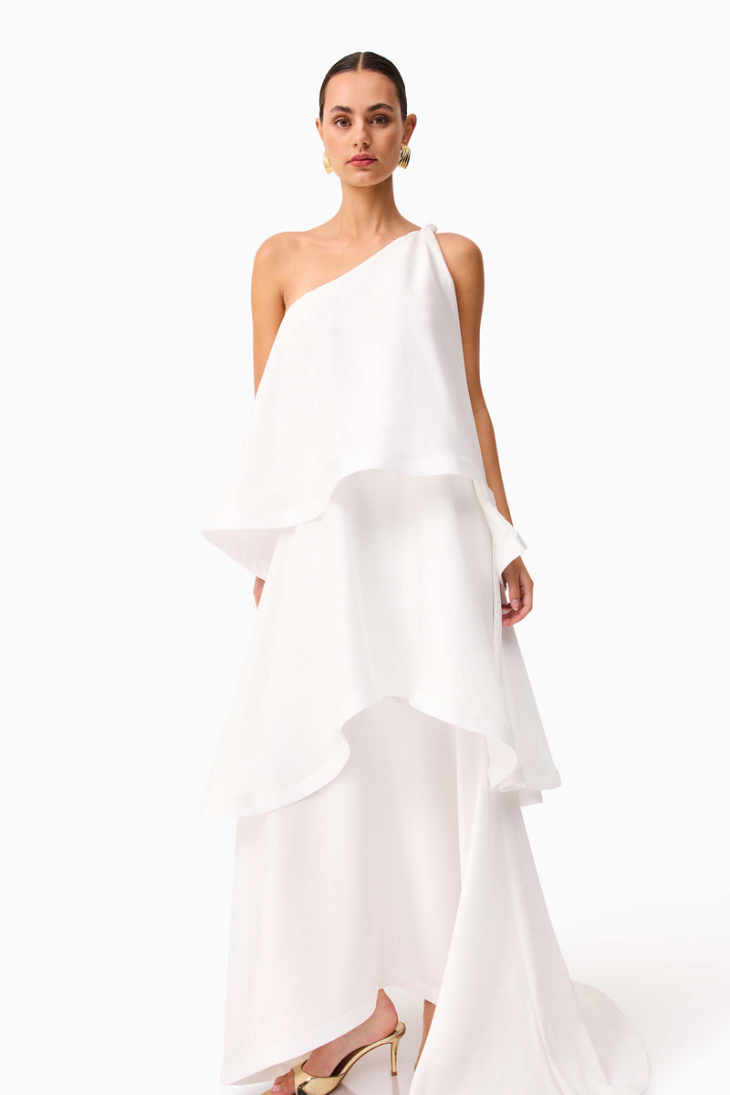 Brunette model wearing Tilly One Shoulder Maxi Dress in White posed shot