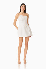 Gemma Floral Mini Dress in White with a strapless neckline, tulip skirt & floral appliques posed shot