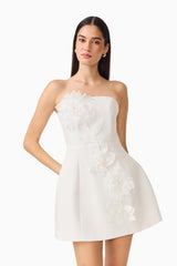 Gemma Floral Mini Dress in White with a strapless neckline, tulip skirt & floral appliques close up shot