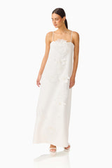 Gemma Floral Maxi Dress in White with floral appliques & relaxed fit posed looking away shot