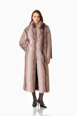 Kinley Faux Fur Coat in Brown with collared neckline and long sleeves posed hand in pocket shot