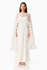 Ellie Cape Maxi Dress in White with a cape with floral trim detailing & column silhouette