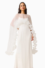 Ellie Cape Maxi Dress in White with a cape with floral trim detailing & column silhouette close up shot