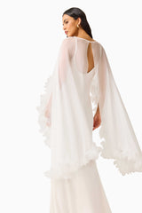 Ellie Cape Maxi Dress in White with a cape with floral trim detailing & column silhouette back close up shot