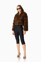 Melanie Cropped Faux Fur Jacket in Brown with collar neckline & long sleeves side posed shot