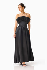 Brunette model wearing the Laurel Sleeveless Maxi Dress in Black posed shot 