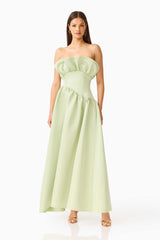 Brunette model wearing the Laurel Sleeveless Maxi Dress in Sage Green posed shot 