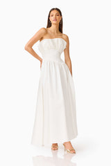 Brunette model wearing the Laurel Sleeveless Maxi Dress in Pearl White hand on hip posed shot 