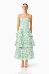 Brunette model wearing the Roseate Tiered Maxi Dress in Mint Green front shot 