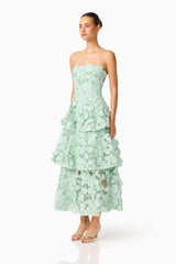 Brunette model wearing the Roseate Tiered Maxi Dress in Mint Green side shot