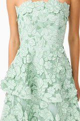 Brunette model wearing the Roseate Tiered Maxi Dress in Mint Green detail shot
