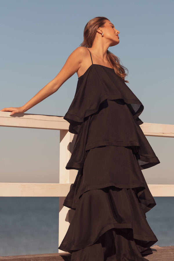 Brunette model wearing Tilly 5 Tiered Maxi Dress in Black front shot