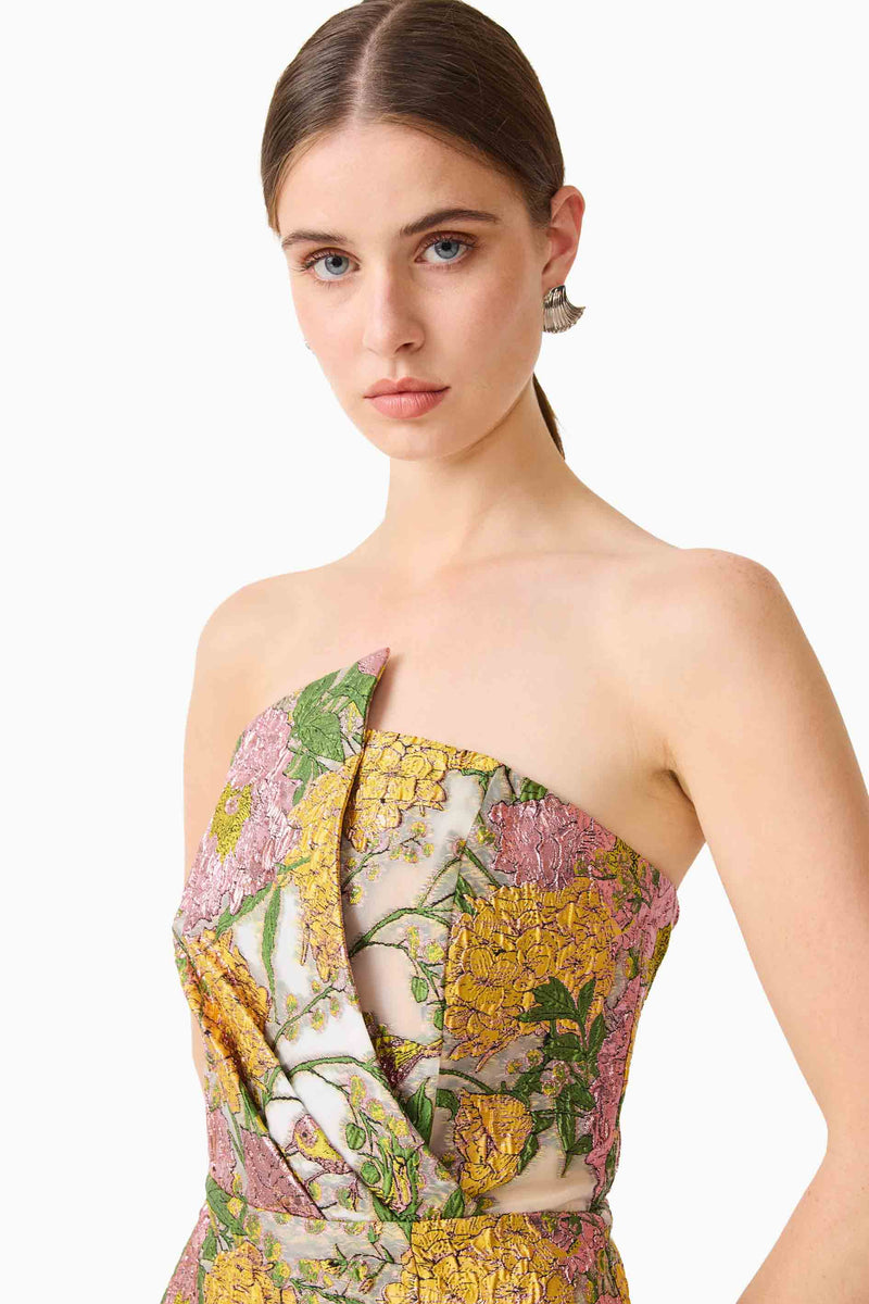 Brunette model wearing the Patricia Strapless Mini Dress in Gold & Purple Floral detail shot