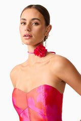 Brunette model wearing Eloise Strapless Mini Dress in Pink & Red detail shot